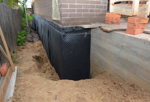 Happy homeowners after waterproofing job in Owings Mills